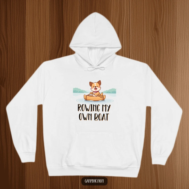 Funny Dog Hoodie: A warm hoodie showcasing a dog happily paddling a small canoe across a calm, beautiful lake.