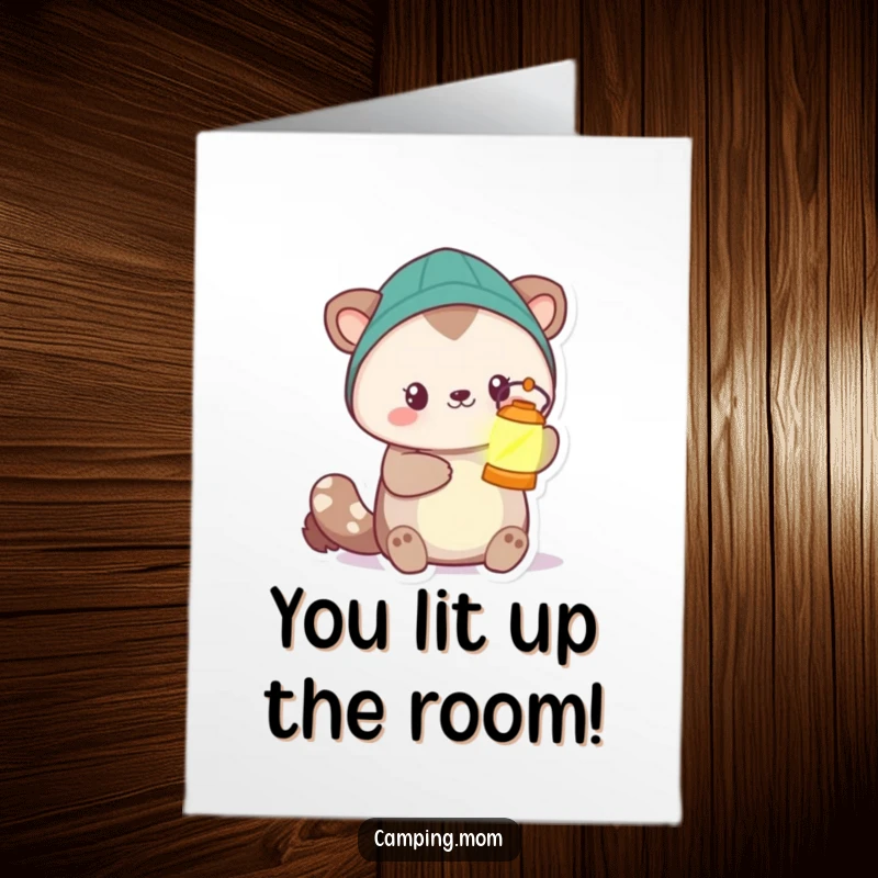 Funny free printable congratulations card: camping animal offering a glowing lantern, symbolizing guidance and success.