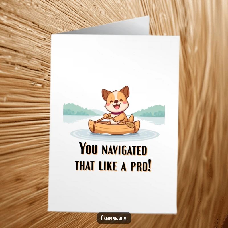 Funny free printable congratulations card with a dog paddling a canoe smoothly across a serene lake.